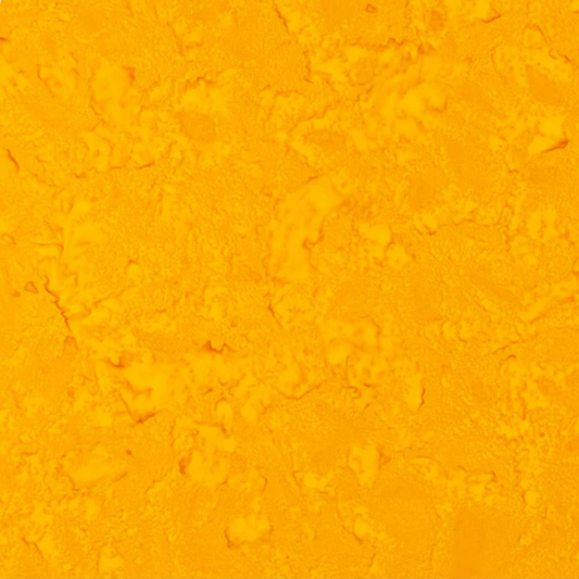 Close-up detail of Expressions Batiks Hand-Dyes Curry quilting cotton fabric highlighting print clarity and rich curry yellow hand-dyed batik texture