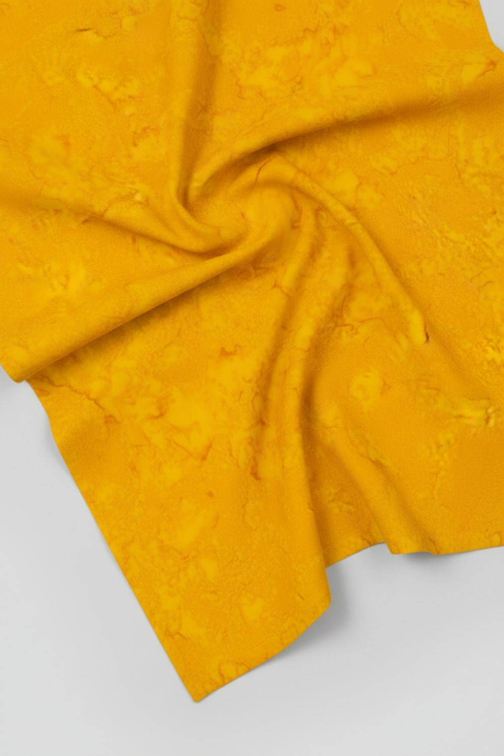 Expressions Batiks Hand-Dyed Curry quilting cotton fabric by Riley Blake Designs – rich golden curry yellow hand-dyed batik in soft folds on flat surface showing texture and tonal variation