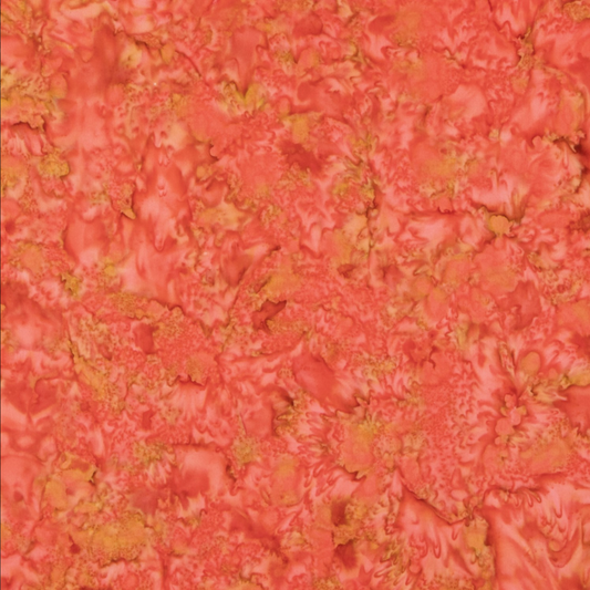 Close-up detail of Expressions Batiks Hand-Dyes Salamander quilting cotton fabric highlighting print clarity and warm coral-orange hand-dyed batik texture