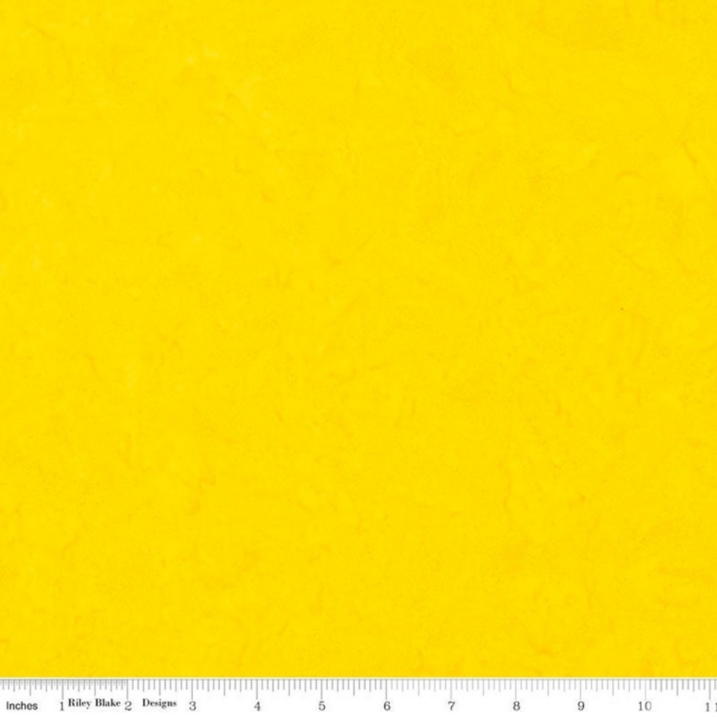 Expressions Batiks Hand-Dyes quilting cotton with ruler showing scale of pattern repeat – Bumblebee bright sunny mid-yellow hand-dyed batik