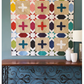 Bold plus blocks and open star elements make this modern lap quilt a showstopper! Crosswalk Plus by Robin Pickens is precut friendly — use a Dessert Roll or Layer Cake. Shop at IraRobi Quilts! #QuiltPattern #RobinPickens #ModernQuilt