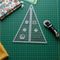 Creative Grids 45 degree Kaleidoscope ruler on cutting mat with rotary cutter for precision quilting
