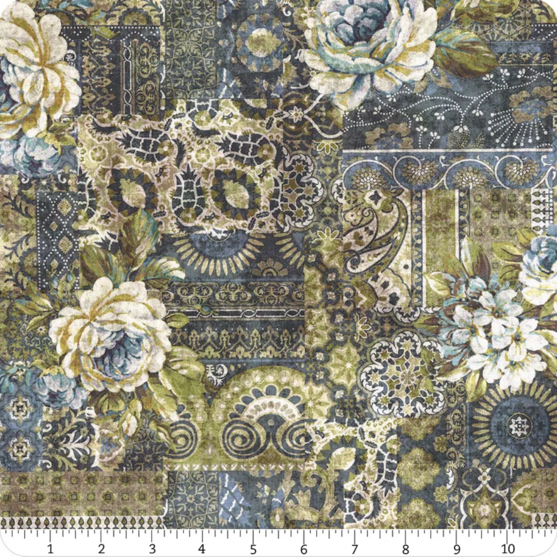 Carpet Bag Romance Blue Carpet quilting cotton fabric with ruler showing scale – large-scale antique carpet patchwork with oversized ivory roses, paisley medallions, scrollwork, and lace motifs in charcoal, olive green, gold, and cream by Jason Yenter for In The Beginning Fabrics, 100% cotton, 3 yard cut