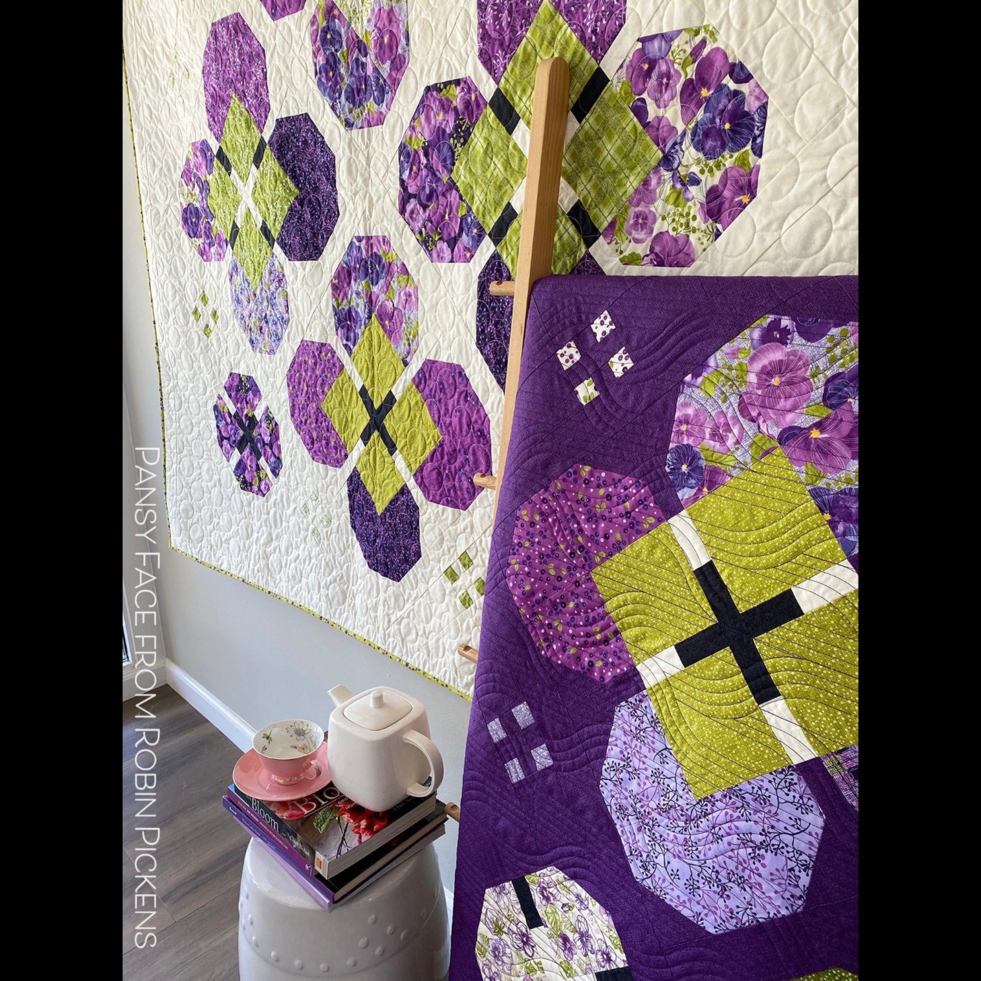 Pansy Face quilt close-up showing purple floral pansy blocks with chartreuse cross centers and accent details in Pansy's Posies fabric by Robin Pickens