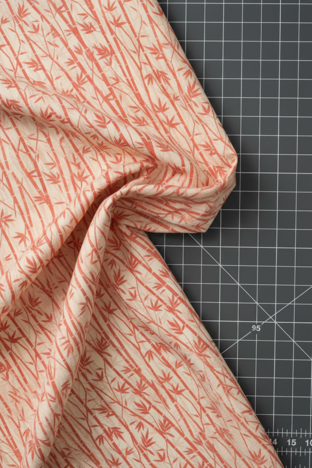 Oriental Gardens Red Bamboo quilting cotton drape view highlighting premium fabric hand and flowing bamboo motifs