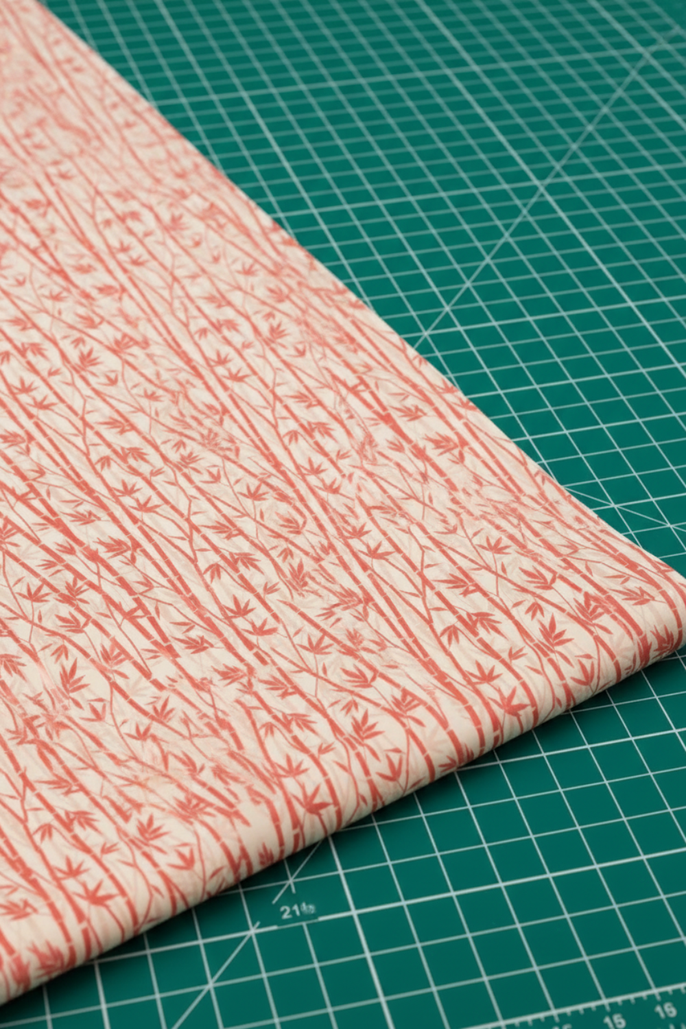 Oriental Gardens Red Bamboo fabric swatch showing true crimson color and graceful bamboo scale detail