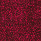 Close-up of Terrazzo Mahogany batik fabric by Riley Blake Designs, with raspberry-magenta pebble-shaped speckles on a mottled deep burgundy ground