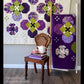 Pansy Face quilt pattern room setting — lap quilt on wall and purple queen quilt on ladder with vintage chair and tea set by Robin Pickens