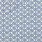 Close-up of NYSNO Blue Snowflake Grid quilting cotton showing detailed blue snowflakes in geometric layout