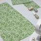 Winter Solstice II Green on White Snow Swirl quilting cotton styled with quilting notions – winter sewing inspiration