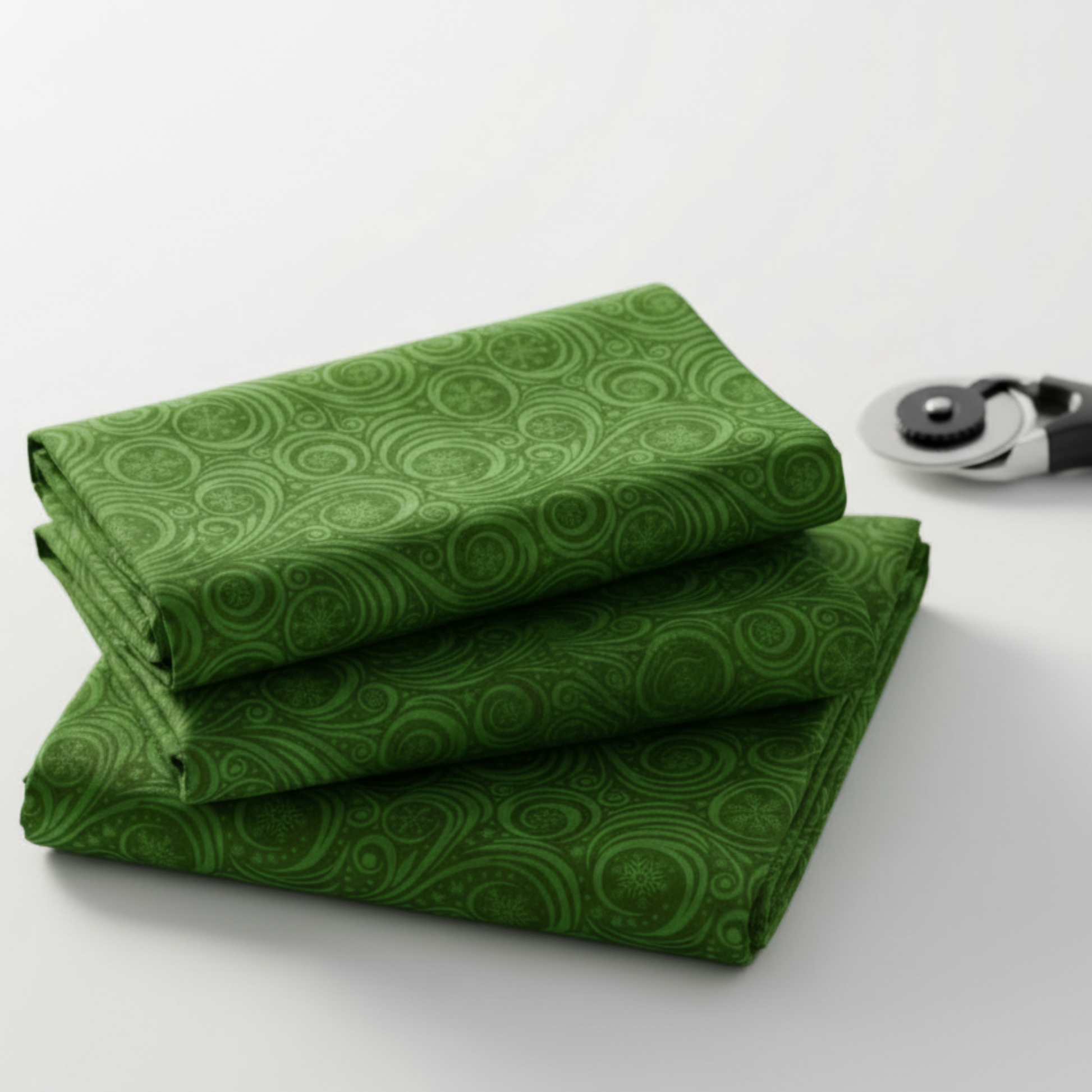 Close-up of Winter Solstice II Green Snow Swirl quilting cotton showing detailed tonal green swirl pattern