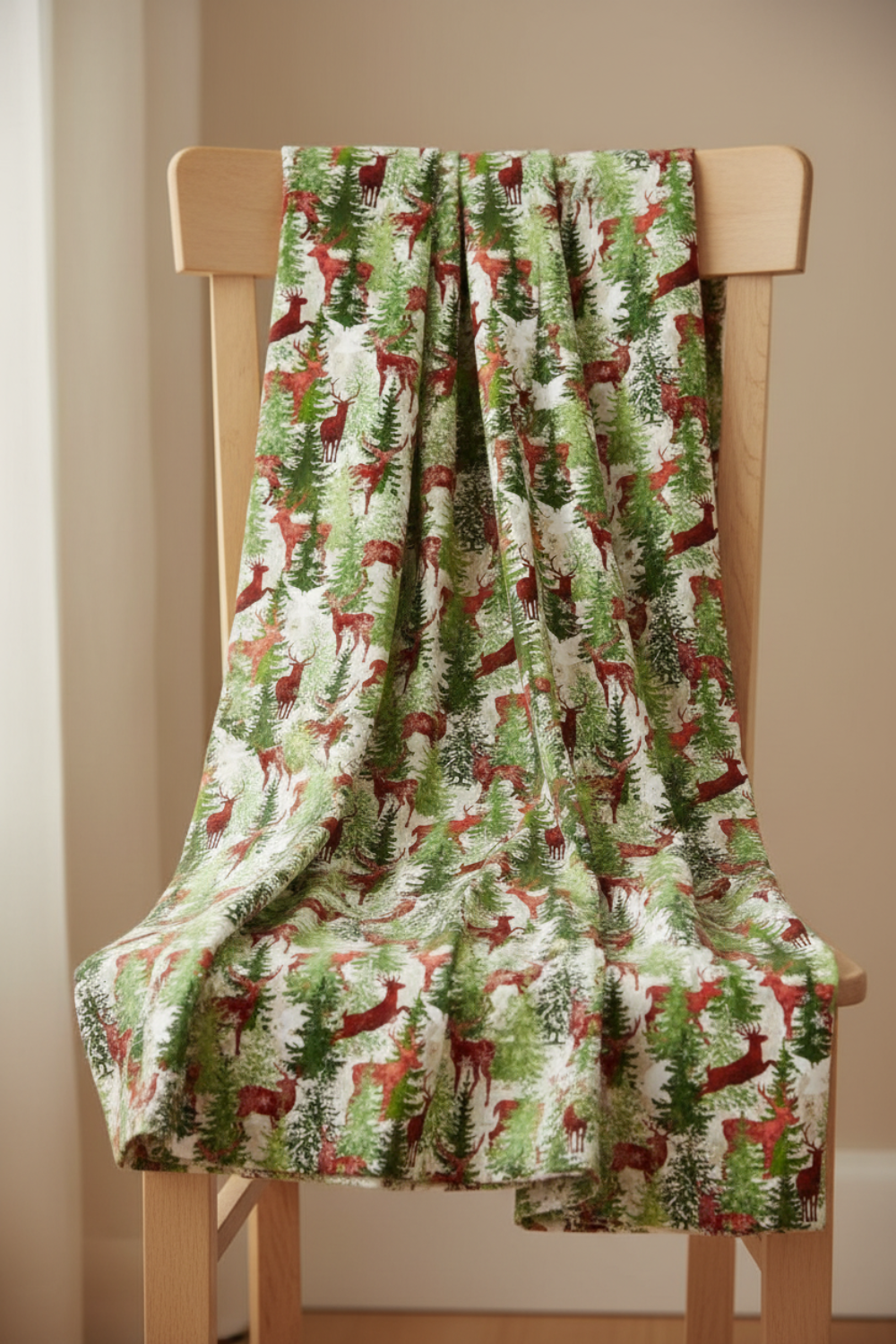 Winter Solstice II Multi Deer Metallic quilting cotton on bolt with pleated folds – lifestyle shot for quilters