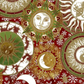 Winter Solstice II Multi Celestial Metallic quilting cotton by Jason Yenter for In The Beginning Fabrics — jewel-toned celestial collage with engraved sun medallions, crescent moons, mandala rings, snowflakes, and clouds in deep crimson, forest green, gold metallic, and cream, stunning focal or feature fabric for holiday quilts, wall hangings, and seasonal home décor, 100% cotton with metallic accents. Quilt blocks shown for inspiration. Coordinating fabrics and quilt patterns are available at IraRobi Quilt