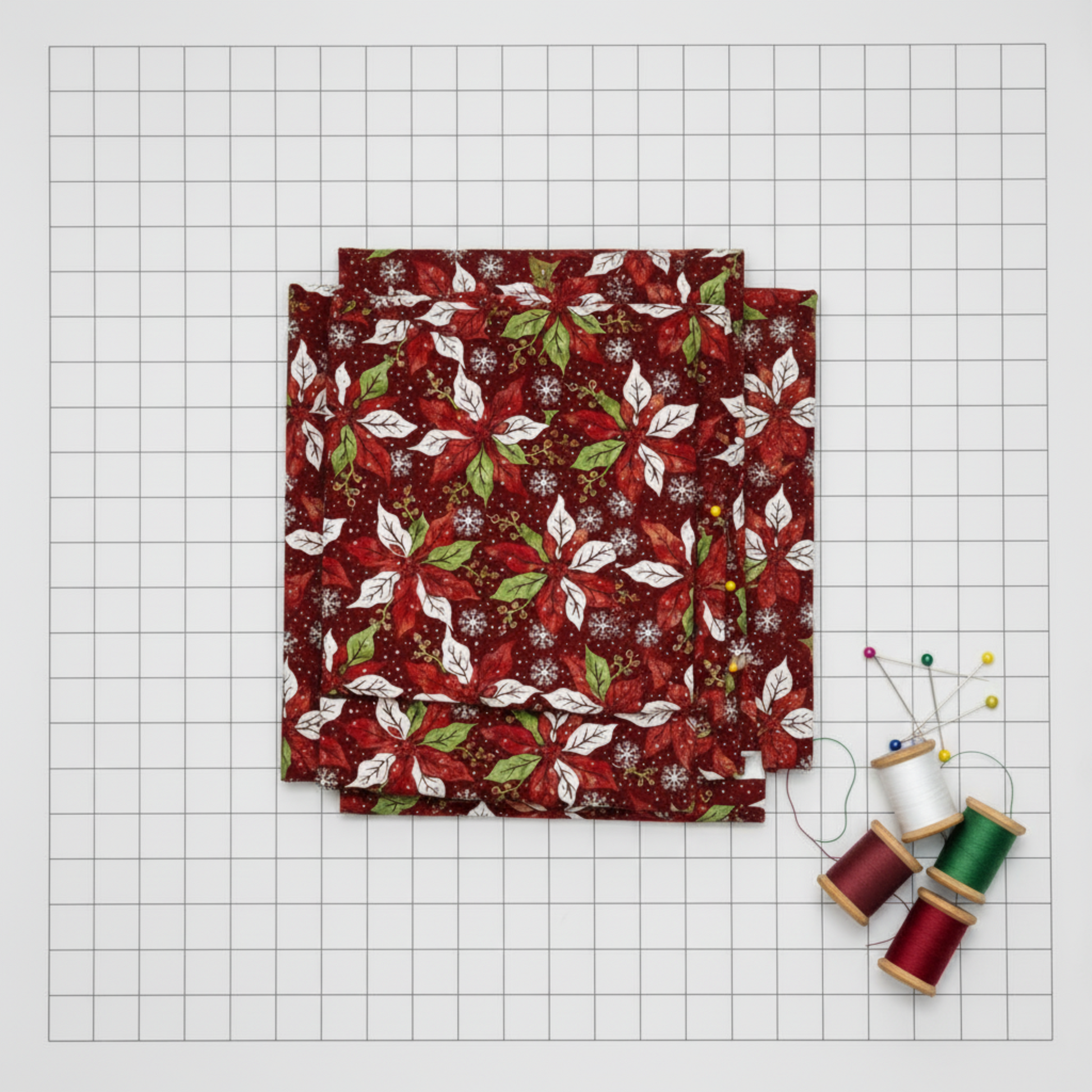 Detailed view of Winter Solstice II Red Poinsettia Metallic cotton fabric highlighting elegant poinsettias and metallic design
