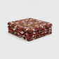 Close-up of Winter Solstice II Red Poinsettia Metallic quilting cotton showing detailed poinsettia motifs and metallic accents