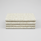 Winter Solstice II Cream Snowflakes Metallic quilting cotton folded stack showing fabric body and drape quality