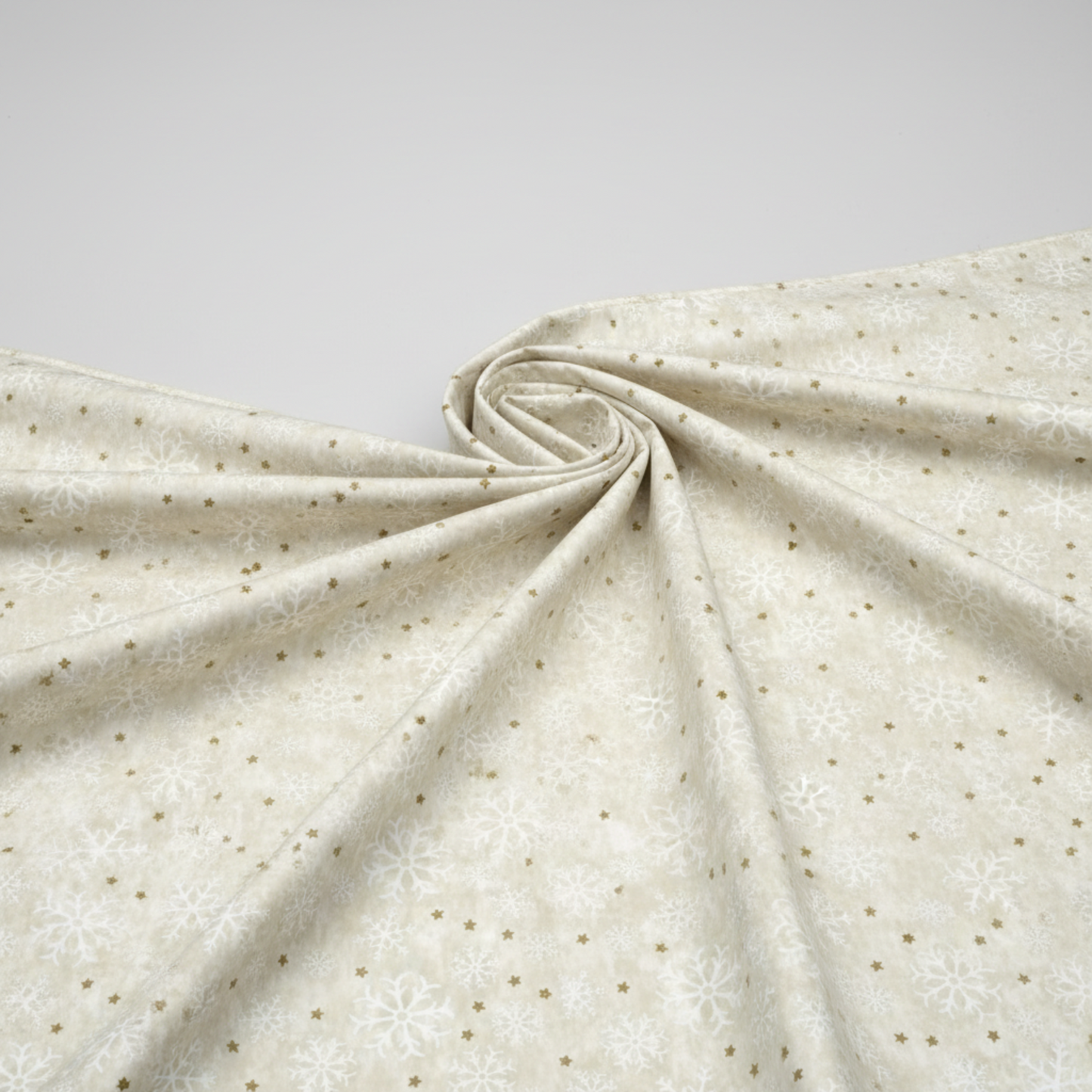 Winter Solstice II Cream Snowflakes Metallic quilting cotton draped to show softness and movement