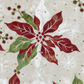 Close-up detail of Winter Solstice II Cream Poinsettia Metallic quilting cotton fabric highlighting print clarity and texture