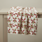 Winter Solstice II Cream Poinsettia Metallic quilting cotton draped to show softness and movement