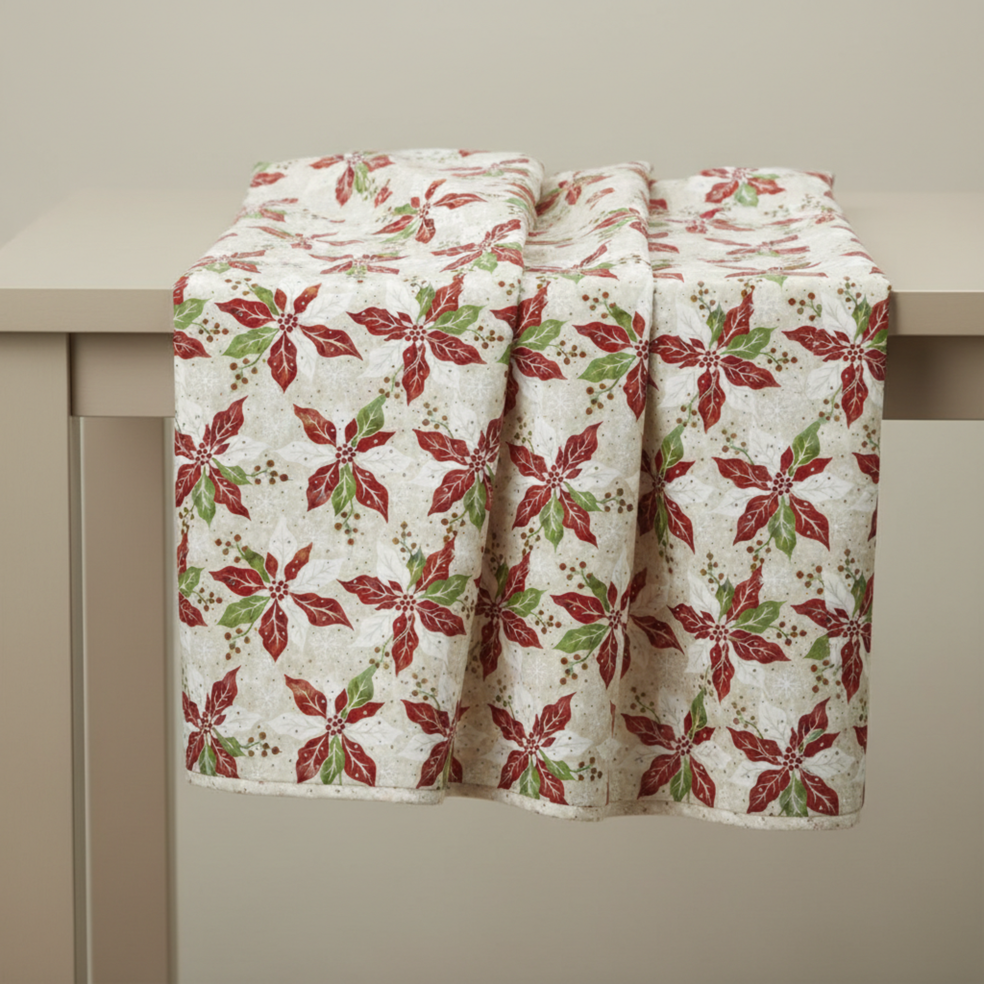 Winter Solstice II Cream Poinsettia Metallic quilting cotton draped to show softness and movement