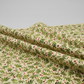 Winter Solstice II Beige Twigs Metallic quilting cotton laid flat with gentle drape showing fabric flow and texture
