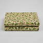 Winter Solstice II Beige Twigs Metallic quilting cotton folded stack showing fabric body and drape quality