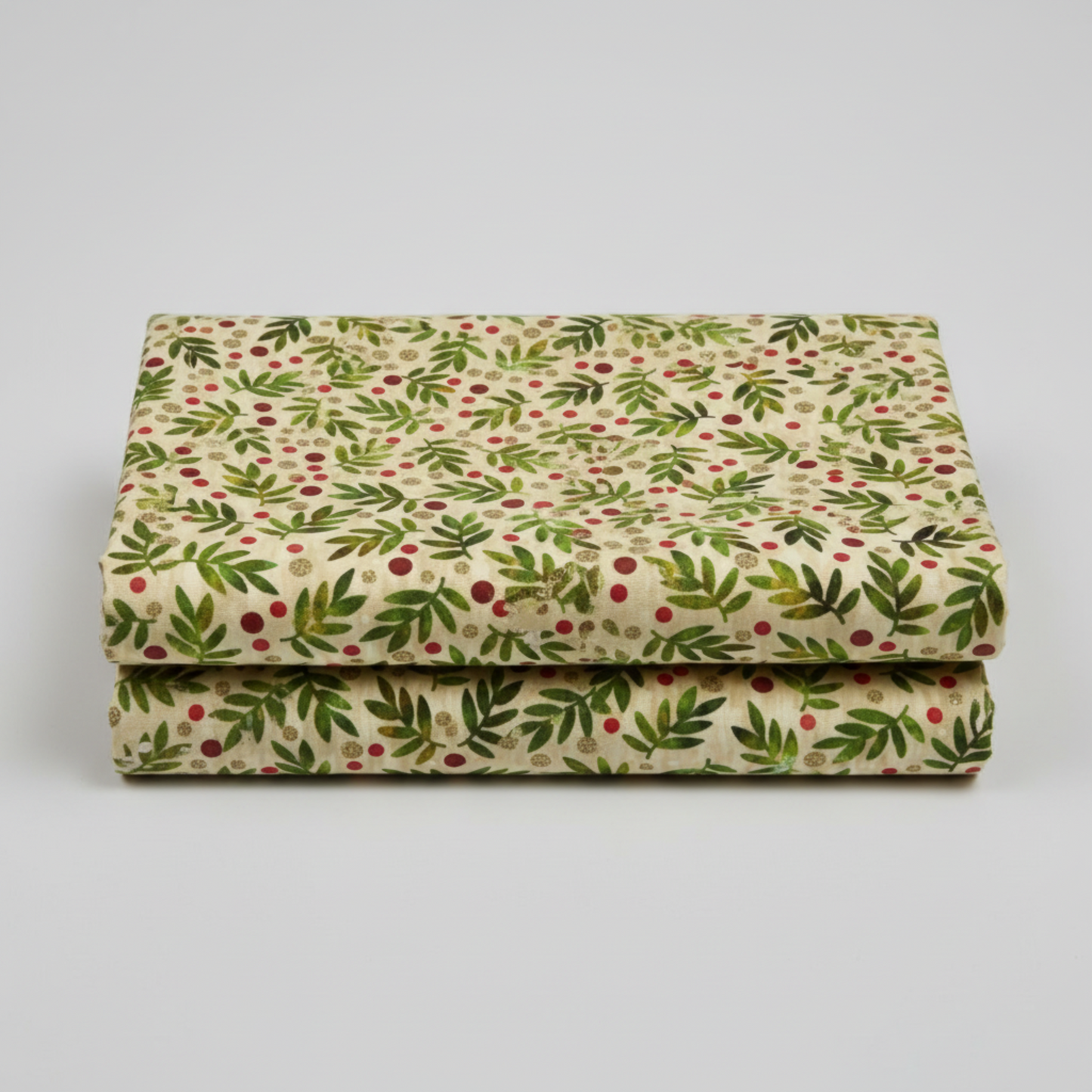 Winter Solstice II Beige Twigs Metallic quilting cotton folded stack showing fabric body and drape quality