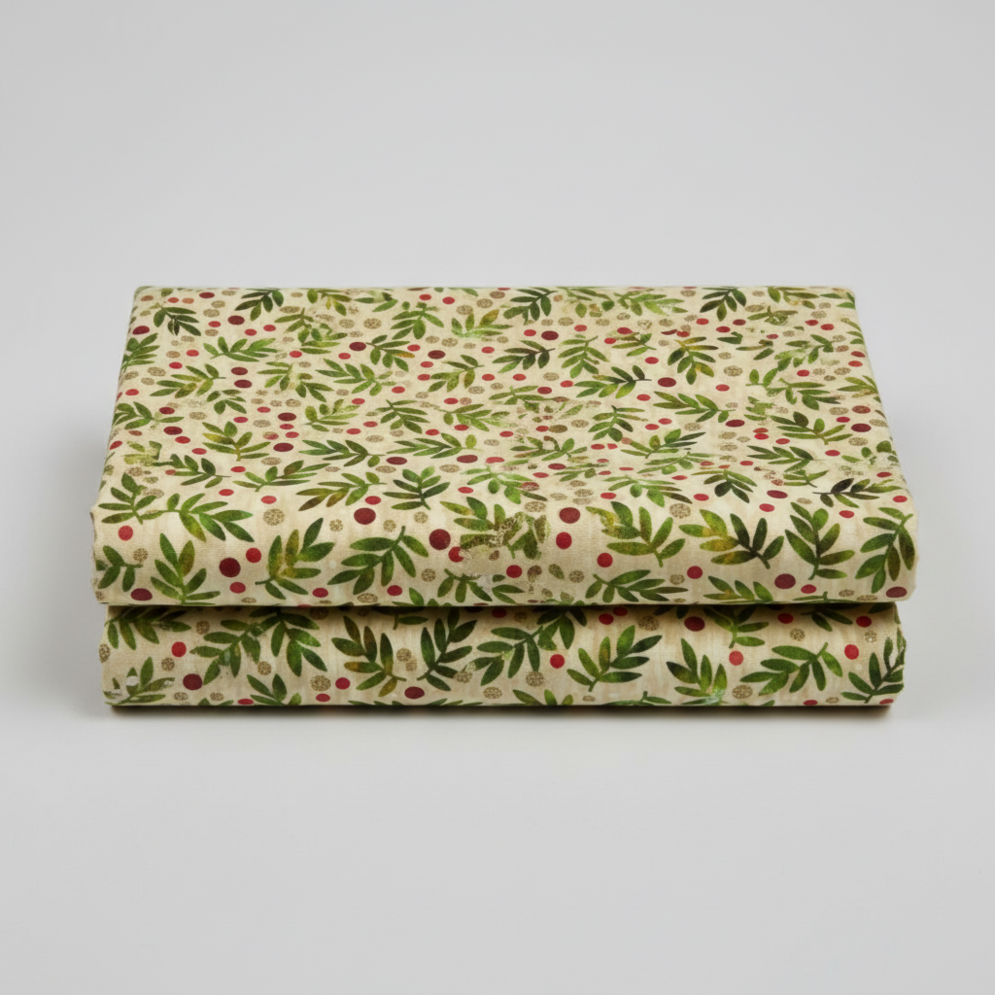 Winter Solstice II Beige Twigs Metallic quilting cotton folded stack showing fabric body and drape quality