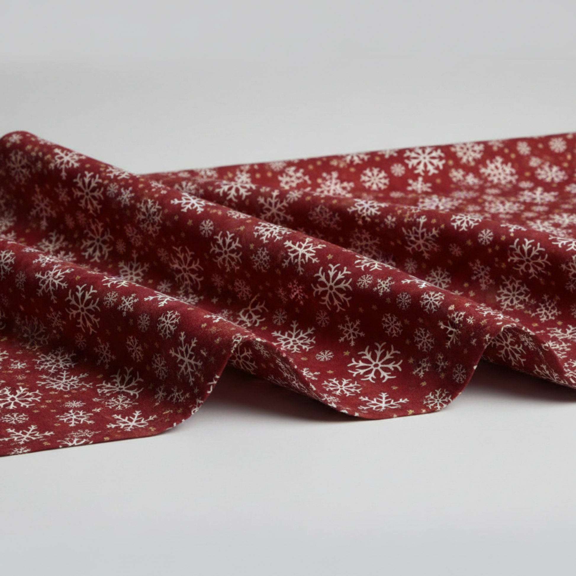 Winter Solstice II Red Snowflakes Metallic quilting cotton draped to show softness and movement