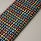 On the Go Plaid Multi quilting cotton folded on the bolt to show fabric softness and vibrant plaid colors