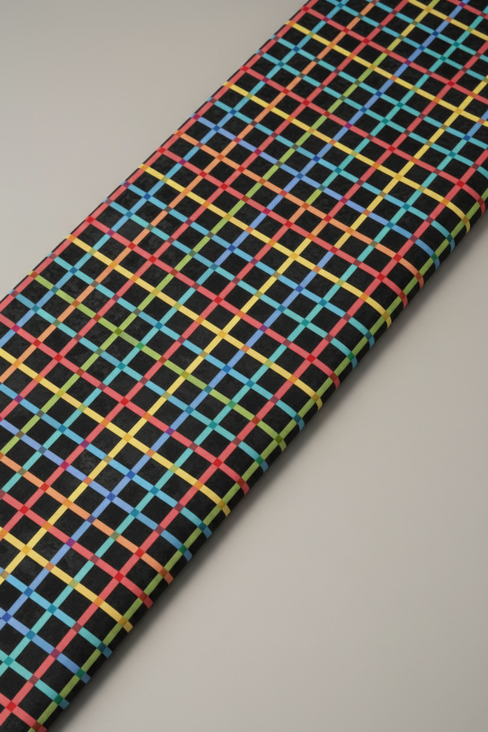 On the Go Plaid Multi quilting cotton folded on the bolt to show fabric softness and vibrant plaid colors
