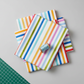 Close-up of On the Go Stripes Multi quilting fabric highlighting crisp multicolor stripe design and smooth cotton texture