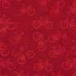 Close-up detail of On the Go Bicycles Red quilting cotton fabric highlighting whimsical bicycle illustration