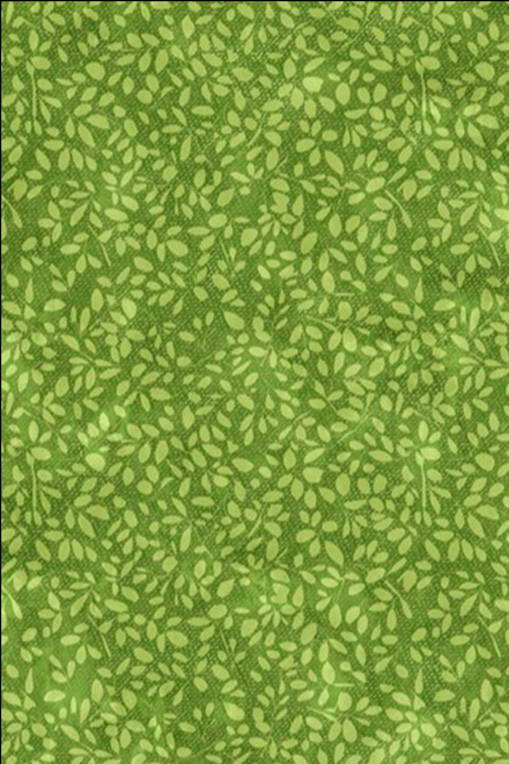 On the Go Leaves Green quilting cotton by Jason Yenter for In The Beginning Fabrics — vertical crop flat lay showing dense all-over tone-on-tone leaf print in soft chartreuse-green on a lush grass-green ground. Coordinating fabrics and quilt patterns available at IraRobi Quilts.