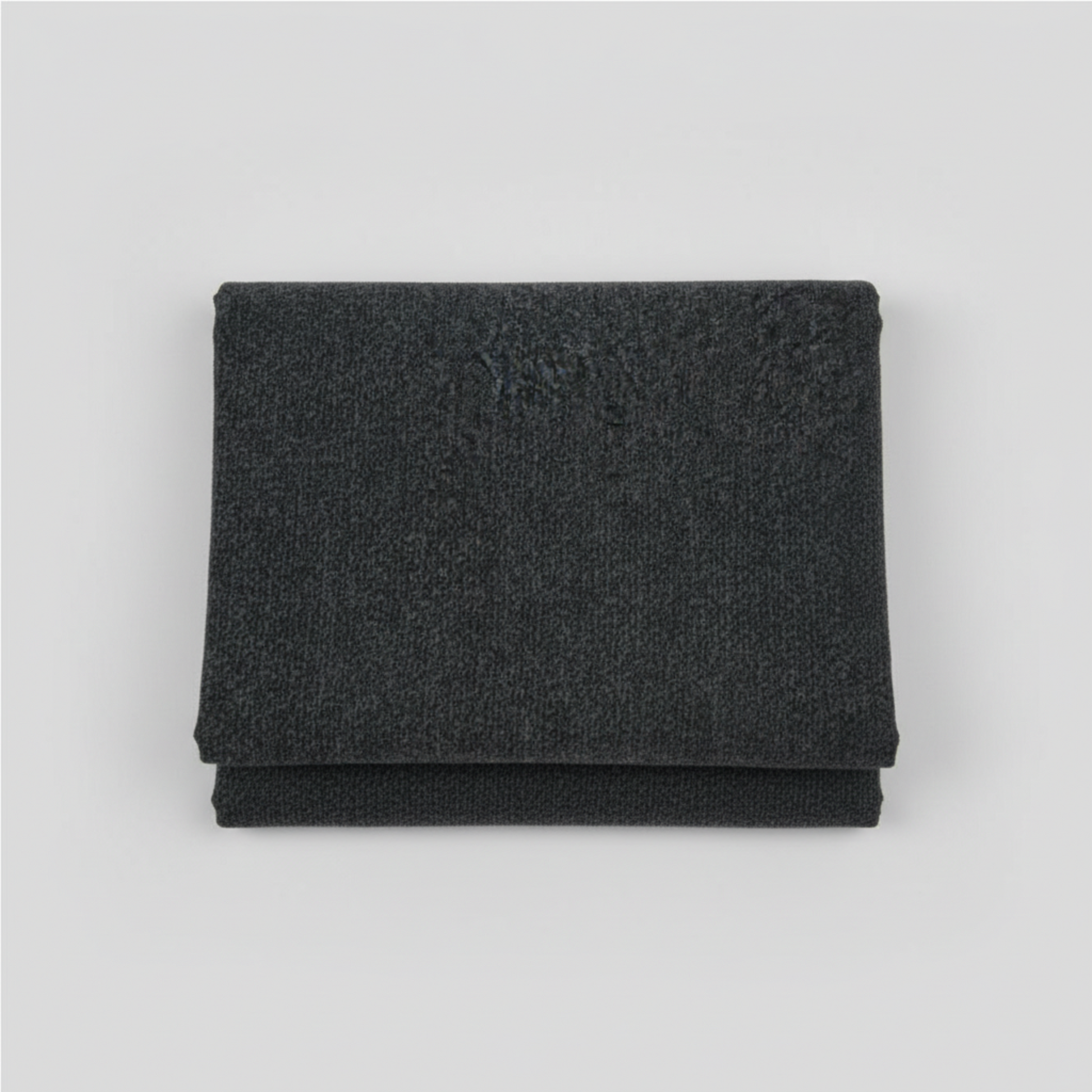 Texture Graphix Speckle Black quilting cotton folded stack showing fabric body and rich black color