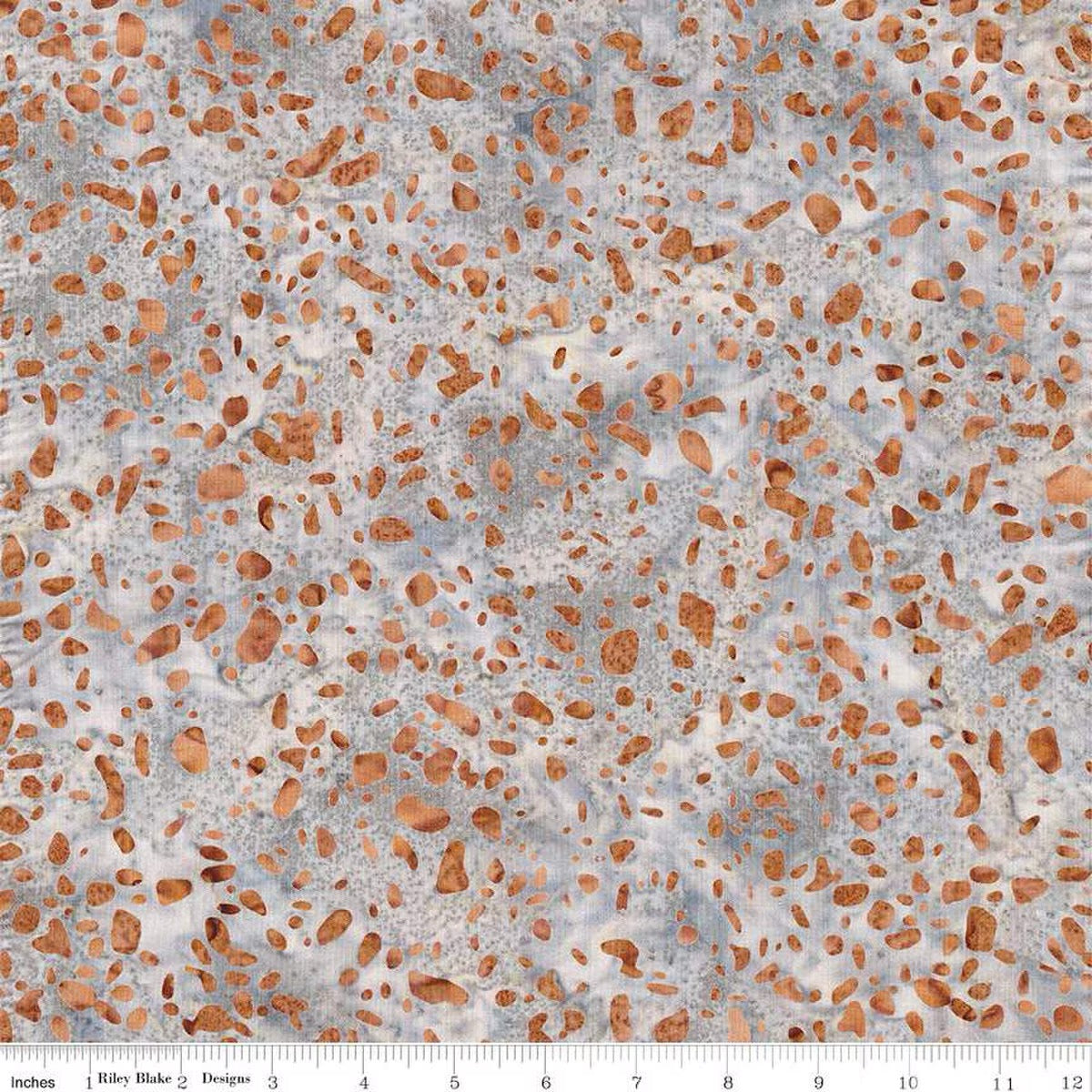 Terrazzo Coastal Path fabric by Riley Blake Designs — rust-orange terrazzo speckles on a soft gray and cream hand-dyed batik, shown with a ruler for scale.