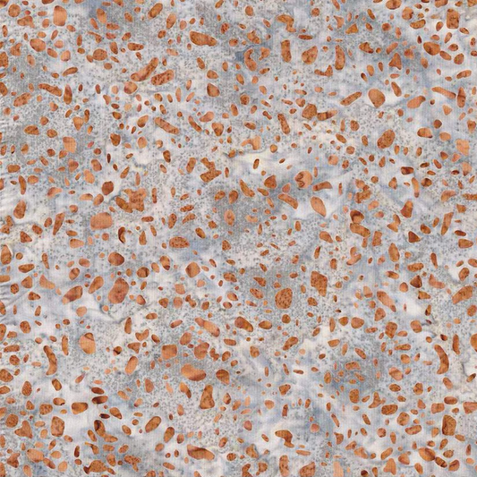Terrazzo Coastal Path Fabric by Riley Blake Designs, featuring peach and copper pebble-shaped flecks on a mottled light-gray and cream background