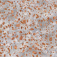 Terrazzo Coastal Path Fabric by Riley Blake Designs, with peach and copper pebble-shaped flecks on a mottled light-gray and cream background.