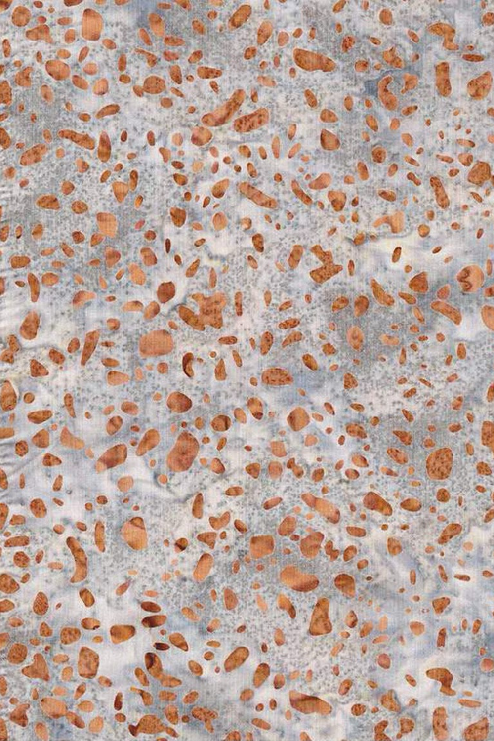 Terrazzo Coastal Path Fabric by Riley Blake Designs, with peach and copper pebble-shaped flecks on a mottled light-gray and cream background.