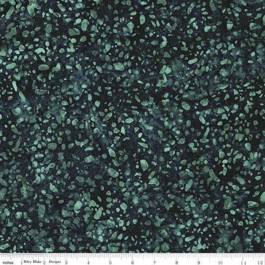 Terrazzo Smoky Teal fabric by Riley Blake Designs — soft teal terrazzo speckles on a dark navy-teal hand-dyed batik, shown with a ruler for scale.