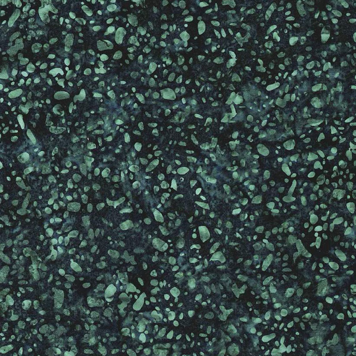 Close-up of Terrazzo Smoky Teal batik fabric by Riley Blake Designs, showing irregular soft teal speckles and mottled texture on a dark navy-teal ground.