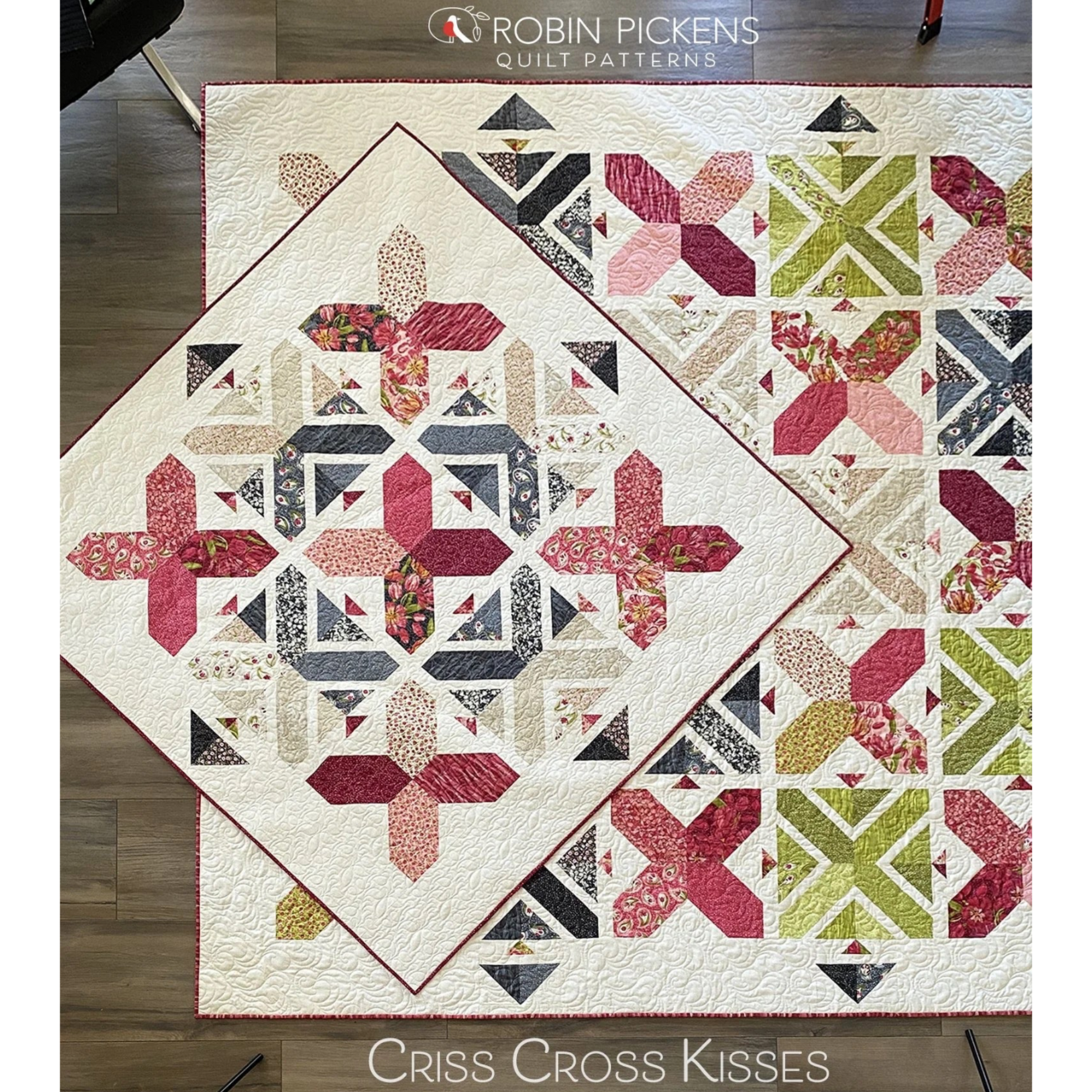Criss Cross Kisses quilt pattern overhead flat lay by Robin Pickens — crimson and navy colorway alongside green and pink colorway, showing X blocks and arrowhead sashing on cream background