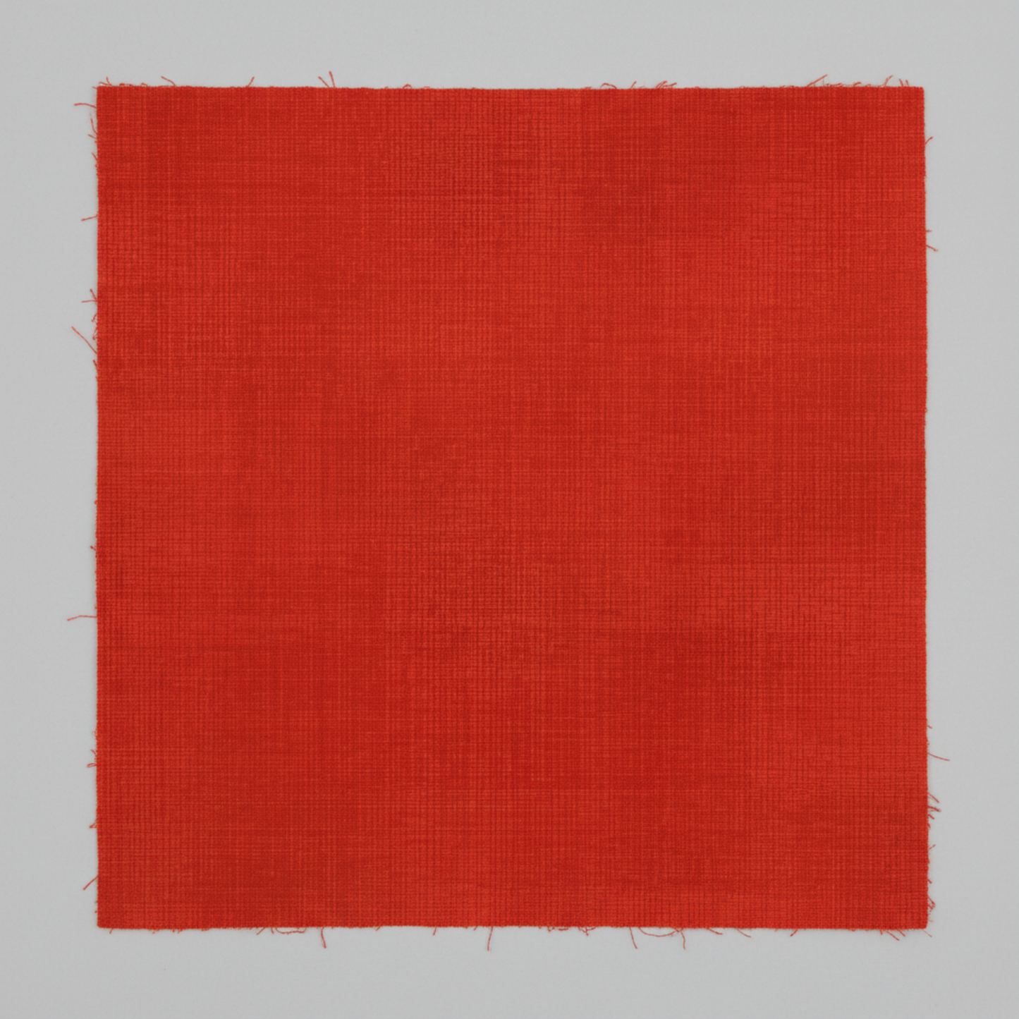 Interwoven Tomato quilting cotton showing fabric texture and geometric pattern detail