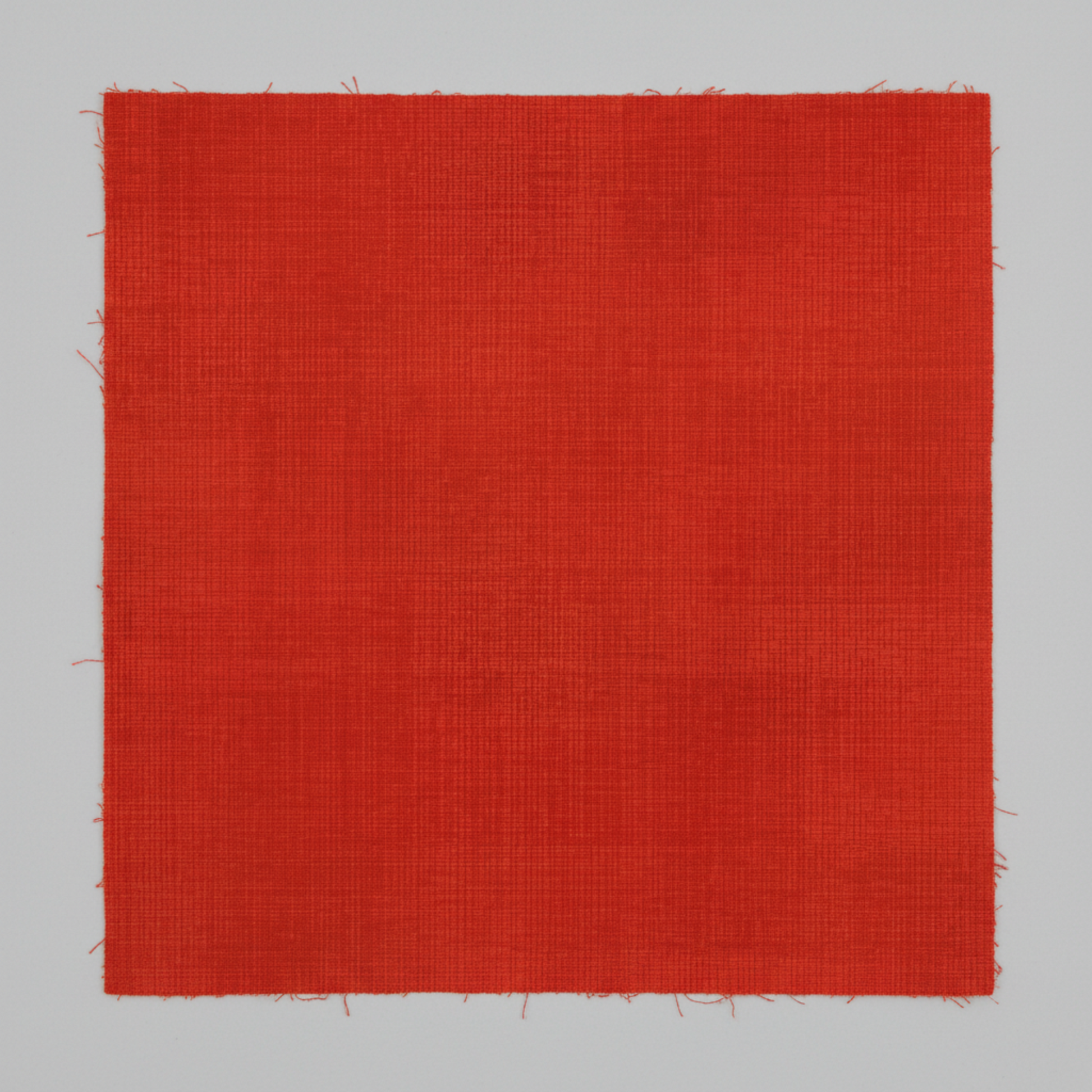Interwoven Tomato quilting cotton showing fabric texture and geometric pattern detail
