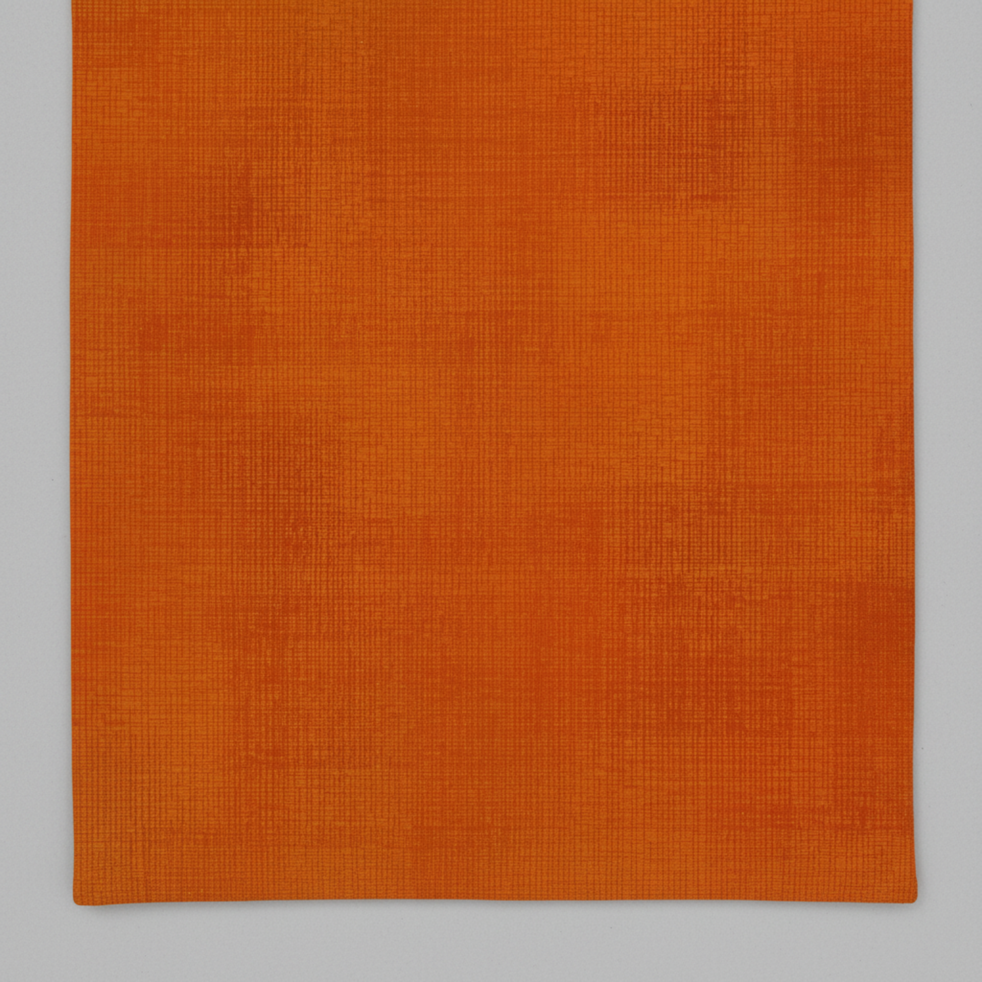 Interwoven Pumpkin quilting cotton showing fabric texture and geometric pattern detail