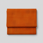 Interwoven Pumpkin quilting cotton fabric by Jason Yenter showing warm pumpkin orange geometric woven pattern