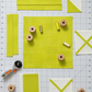Interwoven Citron quilting cotton detail showing intersecting lines and vibrant citron tones in geometric woven pattern