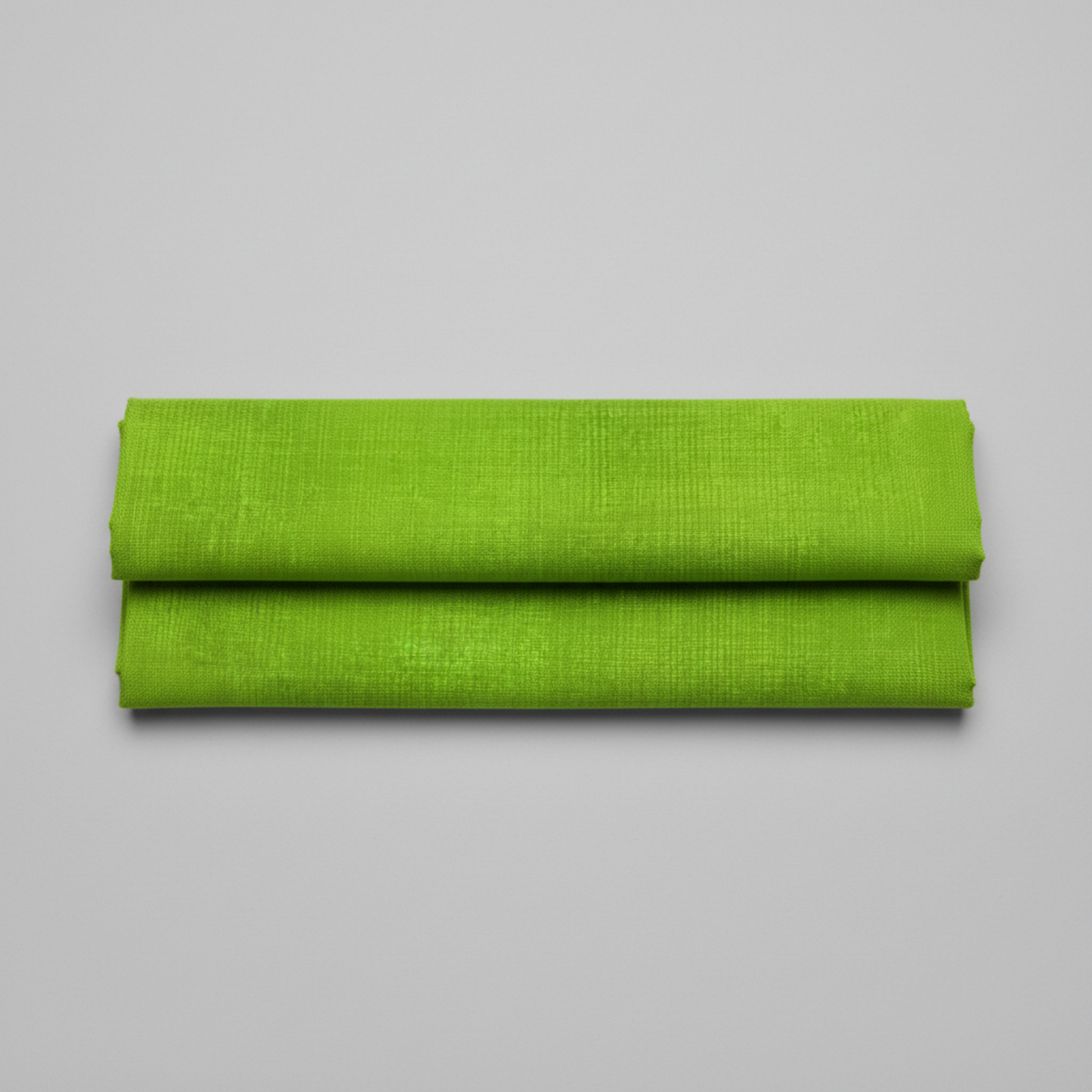 Interwoven Spring Grass quilting cotton showing fabric texture and geometric pattern detail