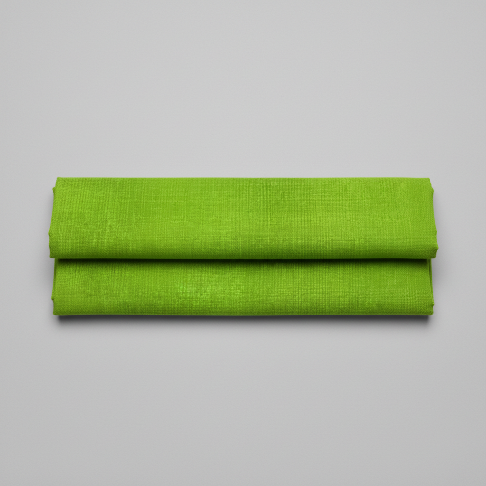 Interwoven Spring Grass quilting cotton showing fabric texture and geometric pattern detail