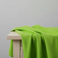 Interwoven Spring Grass quilting cotton fabric by Jason Yenter showing fresh spring grass green geometric woven pattern